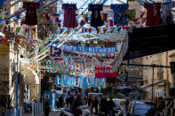 Banners and writings in support of Napoli soccer team are displayed in downtown Naples, Italy, Wednesday, April 19, 2023. It's a celebration more than 30 years in the making, and historically superstitious Napoli fans are already painting the city blue in anticipation of the team's first Italian league title since the days when Diego Maradona played for the club. (AP Photo/Andrew Medichini)