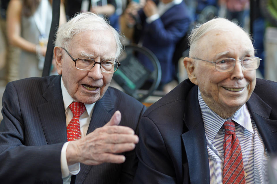 Berkshire Hathaway Chairman and CEO Warren Buffett, left, and Vice Chairman Charlie Munger, briefly chat with reporters Friday, May 3, 2019, one day before Berkshire Hathaway's annual shareholders meeting. An estimated 40,000 people are expected in town for the event, where Buffett and Munger preside over the meeting and spend hours answering questions. (AP Photo/Nati Harnik)