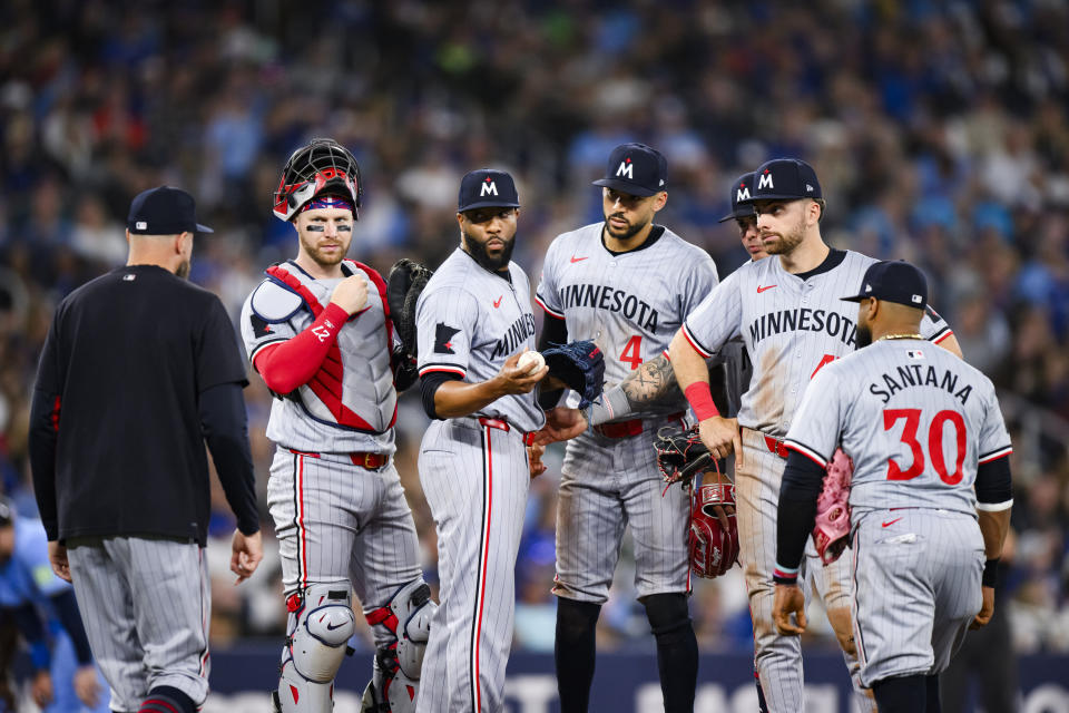 Minnesota Twins pitcher Jay Jackson (32) is relieved after a mound visit during the seventh inning of a baseball game against the Toronto Blue Jays, Saturday, May 11, 2024, in Toronto. (Chris Katsarov/The Canadian Press via AP)