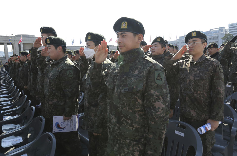 South Korean army soldiers salute during a ceremony to commemorate South Korean soldiers killed in three major clashes with North Korea in the West Sea, in Seoul, South Korea, Friday, March 22, 2019. The South Korean government has designated the fourth Friday of March as the commemoration day for the fallen soldiers in the clashes, including the North's torpedoing of the South Korean Navy corvette Cheonan in 2010, which killed 46 sailors. (AP Photo/Ahn Young-joon)