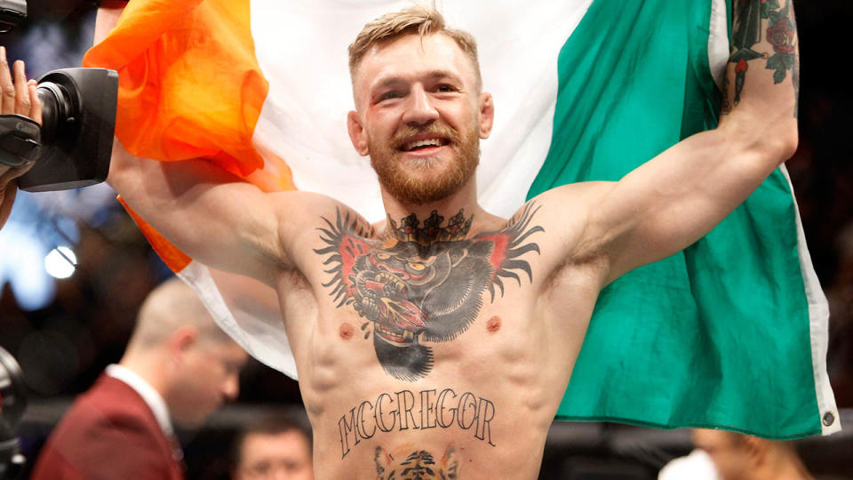 Conor McGregor celebrates after a first-round knockout victory over Jose Aldo in 2015. (Photo by Steve Marcus/Getty Images)