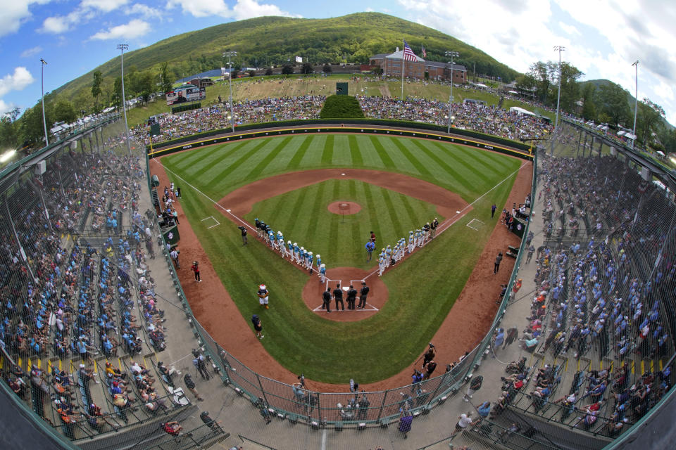 The El Segundo, Calif. team lines the first baseline and the Curacao team lines the third baseline during introductions before the Little League World Series Championship game at Lamade Stadium in South Williamsport, Pa., Sunday, Aug. 27, 2023. (AP Photo/Gene J. Puskar)