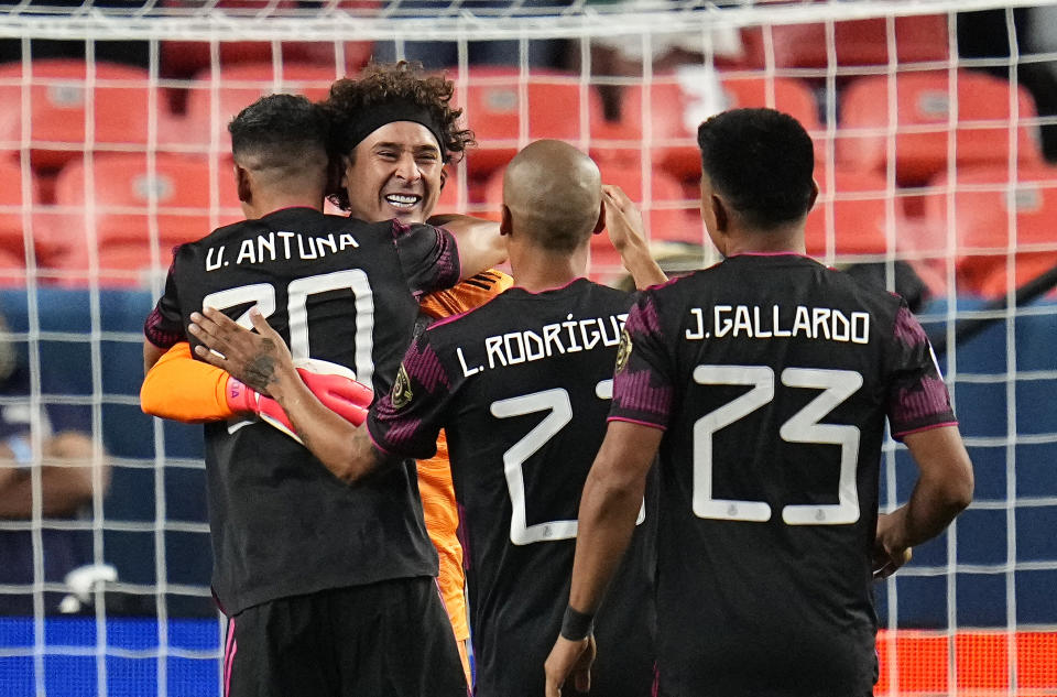 Mexico's Guillermo Ochoa, facing camera, and teammates celebrate a win against Costa Rica on penalty kicks during a CONCACAF Nations League soccer semifinal, Thursday, June 3, 2021, in Denver. (AP Photo/Jack Dempsey)