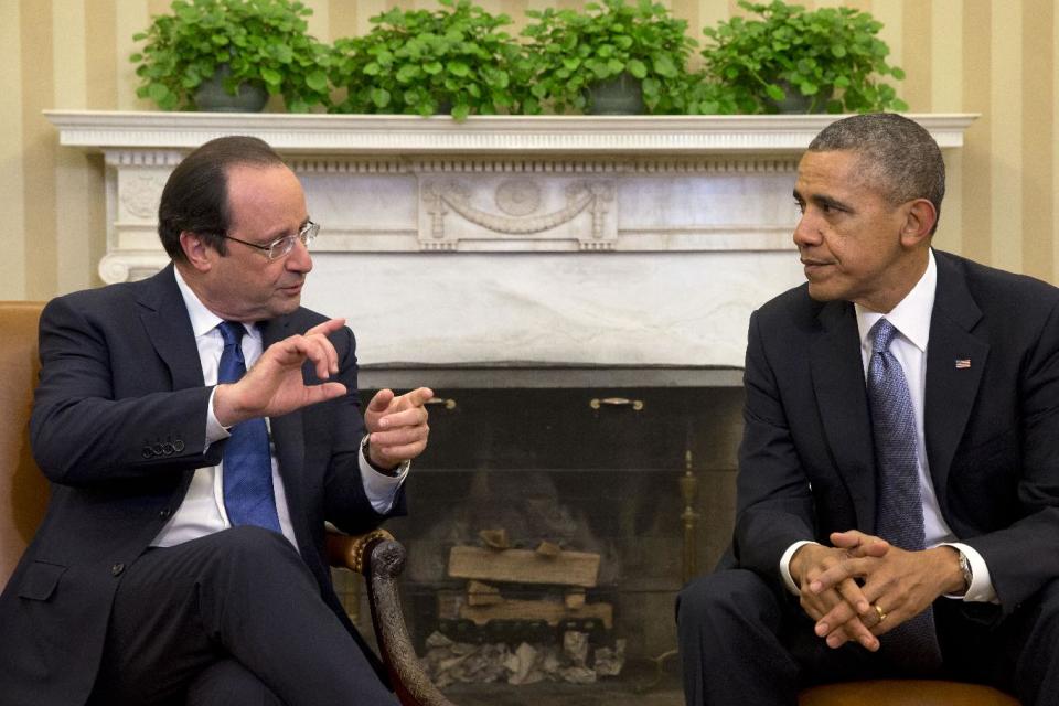 French President Francois Hollande meets with President Barack Obama in the Oval Office of the White House in Washington, Tuesday, Feb. 11, 2014, during a state visit. Lauding the "enduring alliance" between the United States and France, President Barack Obama on Tuesday welcomed President Francois Hollande to the White House for a lavish state visit. The highly anticipated trip is taking place amid swirling speculation on both sides of the Atlantic about problems in Hollande's personal life. (AP Photo/Jacquelyn Martin)