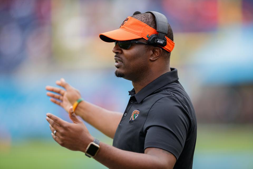 Florida A&M Rattlers head coach Willie Simmons questions a referee before kickoff at the Florida Classic in Orlando on Saturday, Nov. 20, 2021.