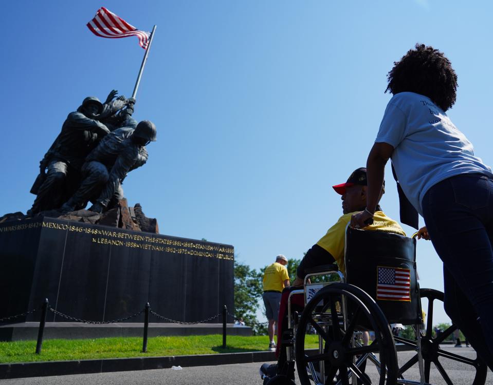 Terry Reid, a Marine who served in Vietnam, and his daughter Karla Tolbert visit the U.S. Marine Corps War Memorial with Honor Flight Tri-State.