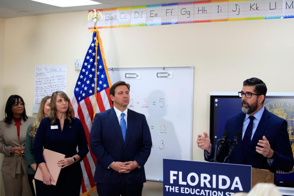 Florida Education Commissioner Manny Diaz, from right, speaks as Gov. Ron Desantis looks on with Florida teacher of the year Melissa Matz, a teacher at Lakeside Junior High School in Clay County, on Monday at Duval Charter School at Baymeadows in Jacksonville.