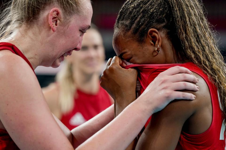 Michelle Bartsch-Hackley, left, and Chiaka Ogbogu are awash with emotion after Team USA beat Brazil for the gold medal at the Tokyo Olympics in 2021. Ogbogu, a former Longhorns star, plays professionally in Turkey.
