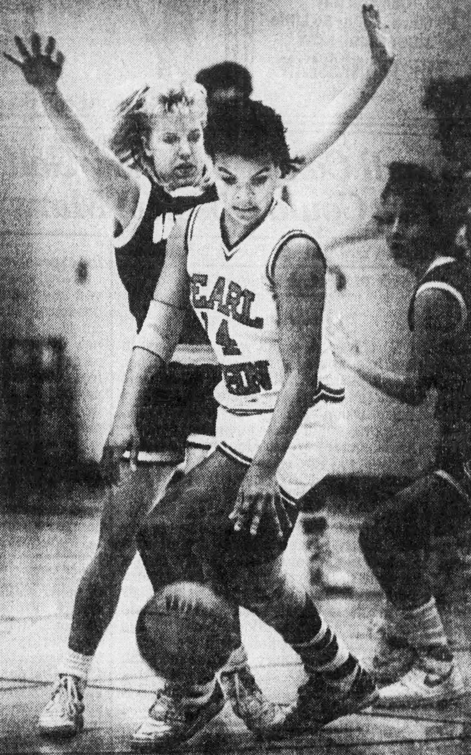 Amy Lannom, Gallatin High (1985-88): Here, Lannom, back, put the pressure on Pearl-Cohn High’s Tonya Marlow (14) during the TSSAA Sub-State game on March 5, 1988.