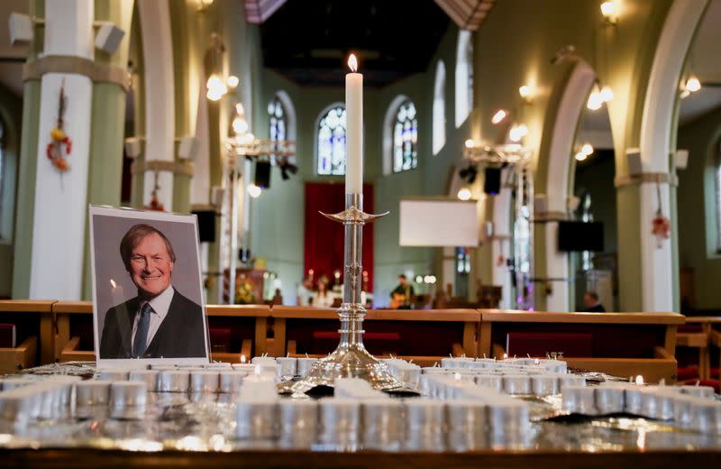 Candles and a portrait of British MP David Amess are seen at the church of St Michael's and all Angels, in Leigh-on-Sea