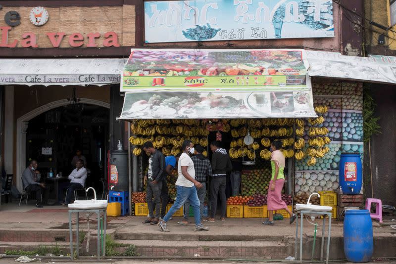 Shoppers are seen outside a grocery store in the Kasanchiz areaa of Addis Ababa