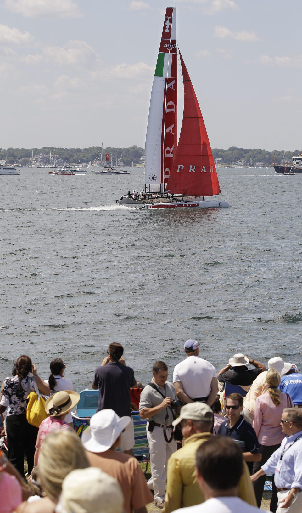 Spectators at Fort Adams State Park watch a match race at the first day of the America's Cup World Series regatta in Newport, RI., Thursday, June 28, 2012. State tourism officials say 7,400 people attended the first day of racing and hope 50,000 people in total will visit the nine-day event, which features four days of racing. (AP Photo/Stephan Savoia)