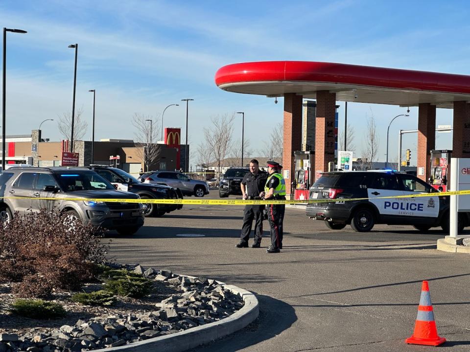 Police officers are investigating the shooting deaths of a father and son in southeast Edmonton Thursday. (David Bajer/CBC - image credit)