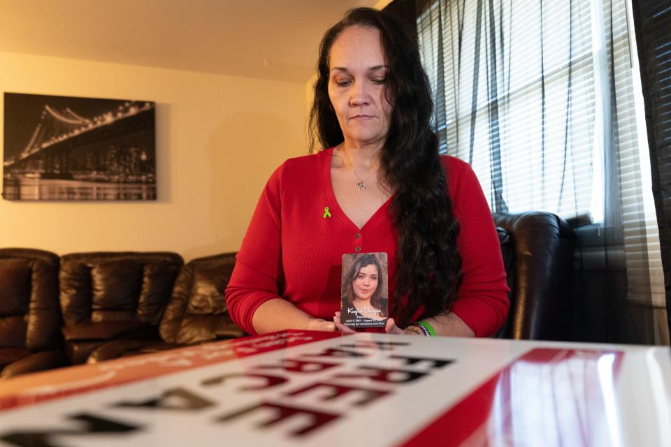 Amber Saale-Burger holds a photo of her late daughter, Kaylee Burger, in December as she shows a Save-a-Life Station. Burger overdosed from fentanyl in August, and Saale-Burger is fighting to help others in similar situations.