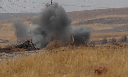 Smoke rises from a controlled explosion in Khazer, Iraq December 1, 2016. Picture taken December 1, 2016. REUTERS/Khalid al Mousily