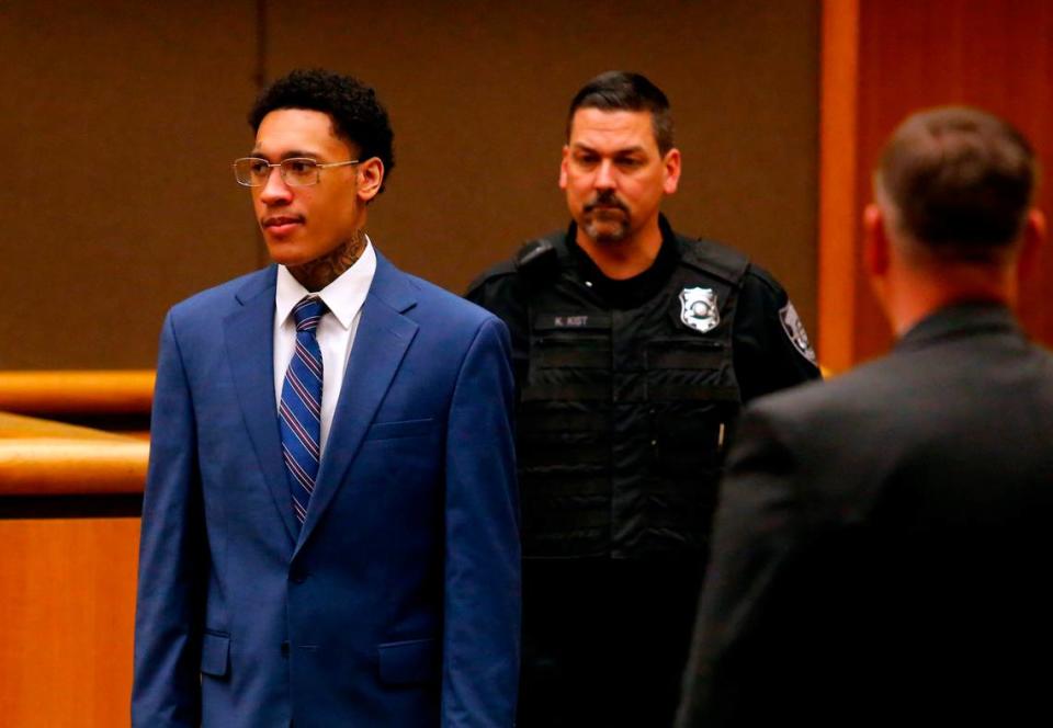 Lawrence Isaiah Groce is brought into a courtroom by a corrections officer at the Benton County Justice Center in Kennewick during his April 2023 murder trial.