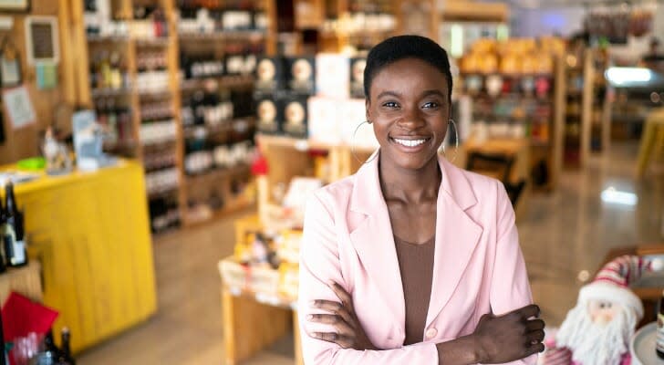 Owner of a liquor store standing inside her business