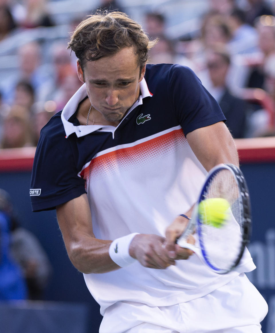 Daniil Medvedev, of Russia, returns to compatriot Karen Khachanov during the Rogers Cup men’s tennis tournament semifinals Saturday, Aug. 10, 2019, in Montreal. (Paul Chiasson/The Canadian Press via AP)