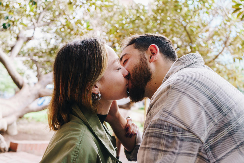 Young couple in love kissing in the park