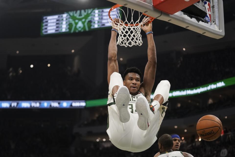 Milwaukee Bucks' Giannis Antetokounmpo dunks during the first half of an NBA basketball game against the Philadelphia 76ers Saturday, Feb. 22, 2020, in Milwaukee. (AP Photo/Morry Gash)