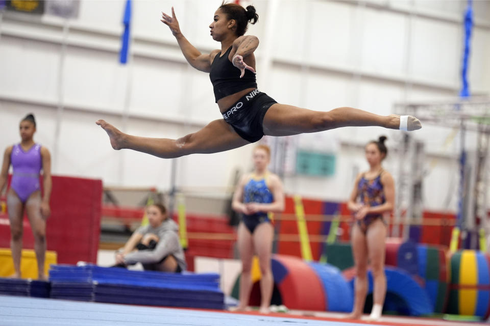 Gymnast Jordan Chiles practices her floor routine Thursday, Feb. 29, 2024, in Spring, Texas. Chiles doesn't have to put herself through this. She knows this. The proof is tattooed on her arm. It's sitting in her trophy room. It's on her social media pages, which are dotted with the kind of partnerships she once never dreamed possible. (AP Photo/David J. Phillip)