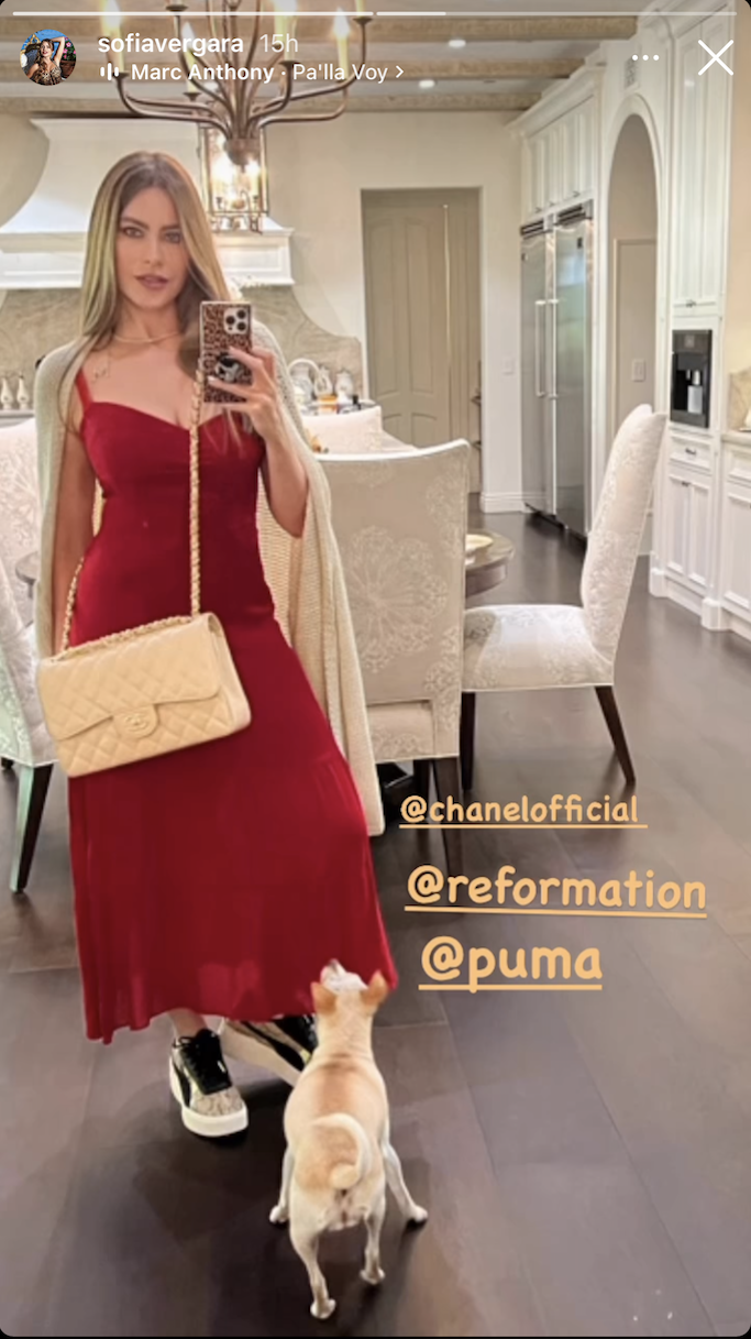 Sofia Vergara wearing a red dress from Reformation, a cream Chanel bag and Black and white Puma sneakers for her IG story. - Credit: Sofia Vergara