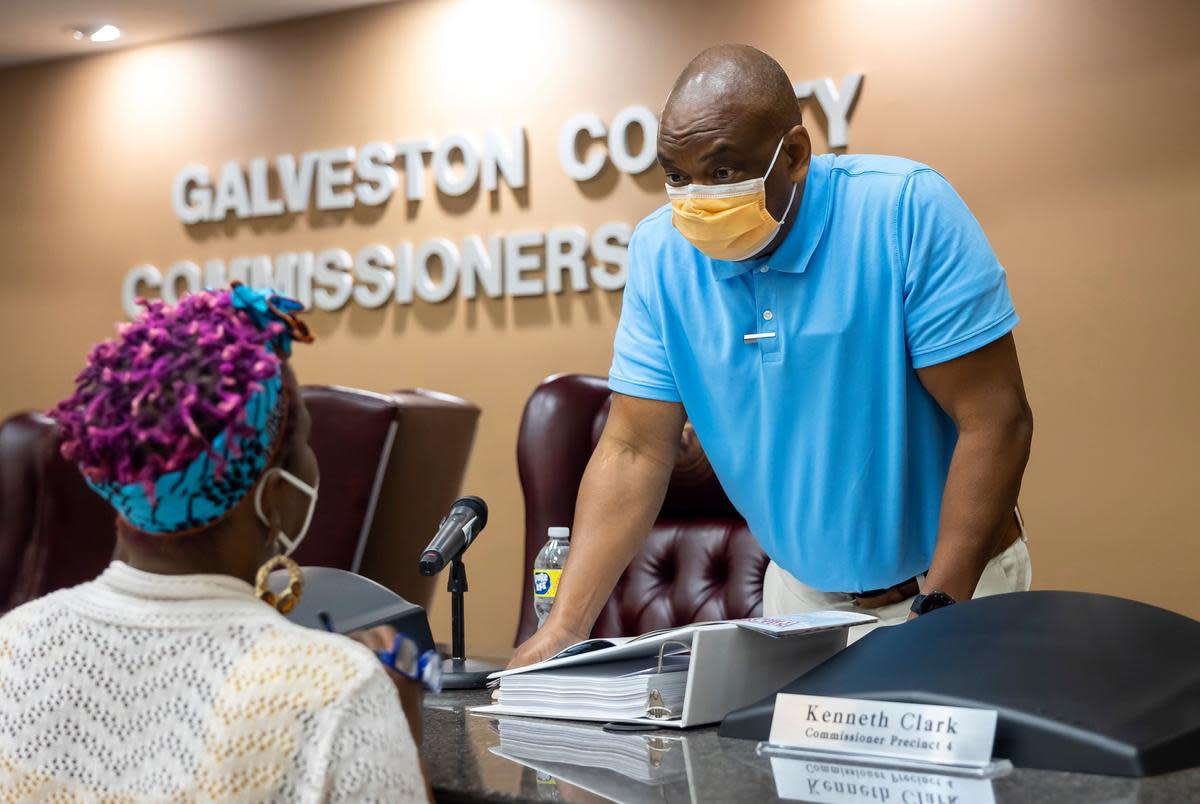 Galveston County Commissioner Stephen Holmes chats with activist Roxy D. Hall Williamson after a Galveston County Commissioners Court meeting in Galveston, TX, on Monday, April 4, 2022.