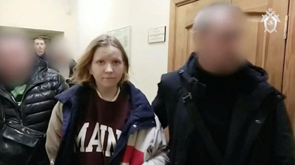 <div class="inline-image__caption"><p>Darya Trepova, suspected of bringing explosives to the cafe where war blogger Vladlen Tatarsky (real name Maxim Fomin) was killed in an explosion the day before, is escorted inside the building of Russian Investigative Committee, in Saint Petersburg, Russia.</p></div> <div class="inline-image__credit">Investigative Committee of Russia via Reuters</div>