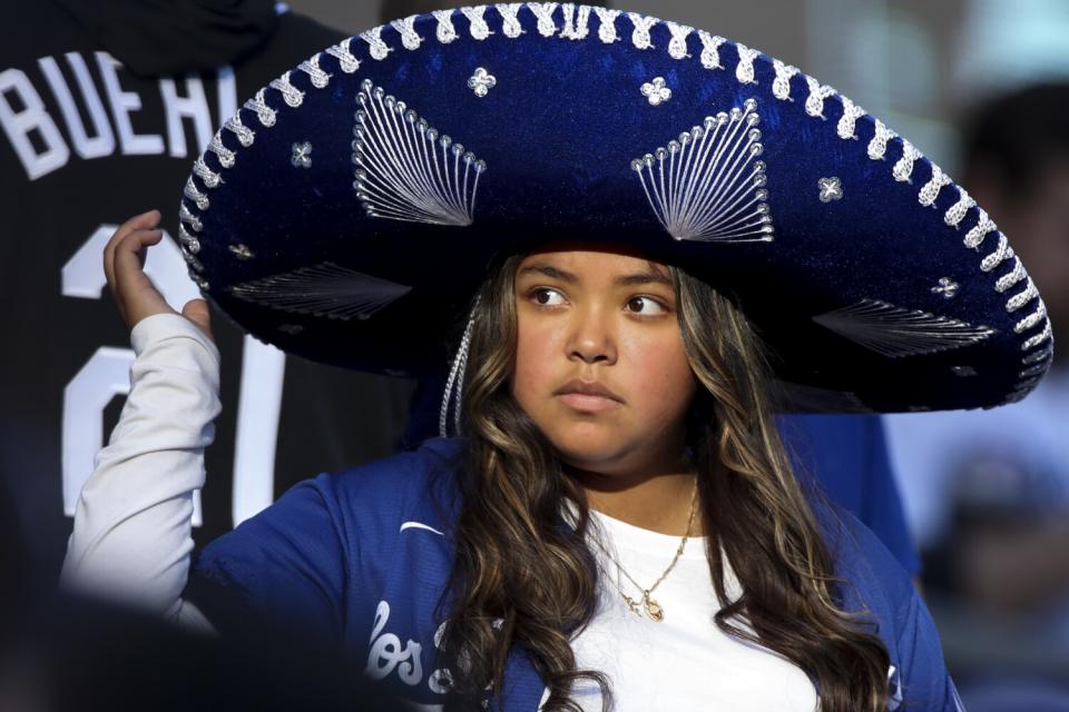 A Dodgers fan wears a sombrero.