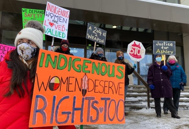 A protest was held outside the courthouse in Whitehorse Monday calling for urgent support to protect Indigenous women from violence. (Philippe Morin/CBC - image credit)