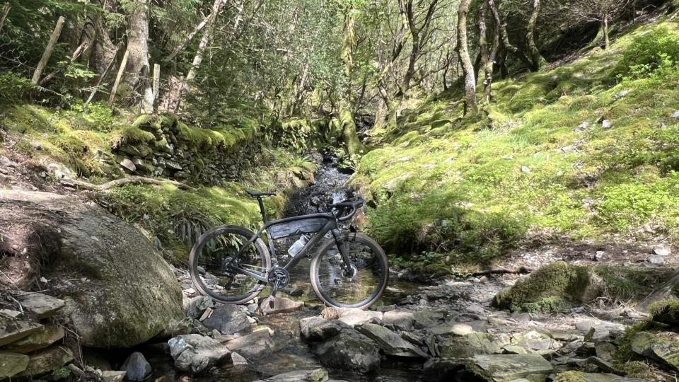Gravel bike in rocky stream bed