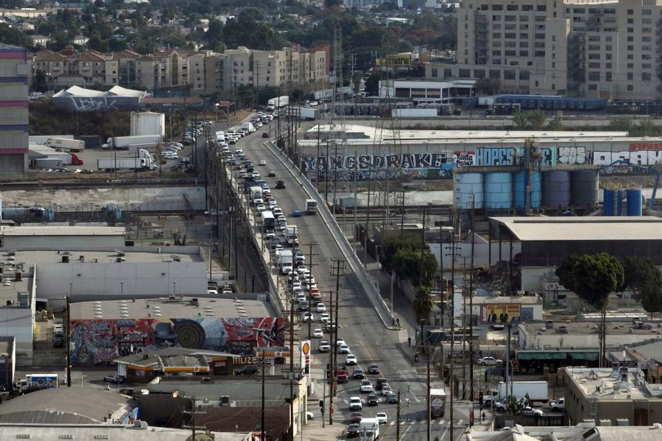 In this aerial view, traffic is backed up near a closed interstate 10 in the aftermath of a fire, Monday, Nov. 13, 2023, in Los Angeles.