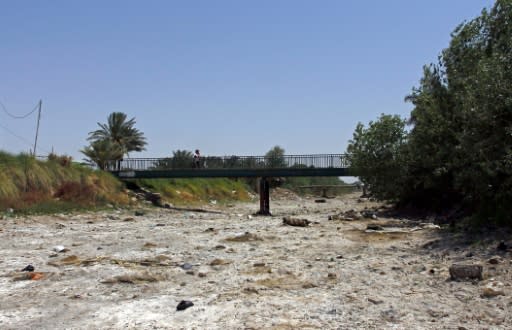 A bridge crosses a dry riverbed in Umm Abbasiyat, some 60 kilometres (35 miles) east of Najaf, pictured on July 5, 2018