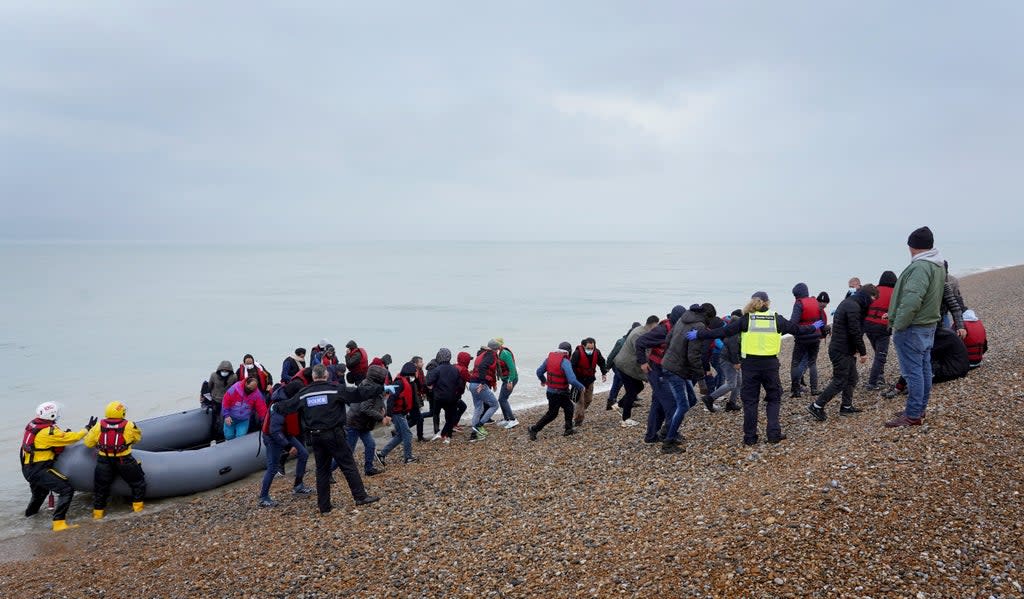 A group of people thought to be migrants are brought in to Dungeness, Kent, by the RNLI following a small boat incident in the Channel (Gareth Fuller/PA) (PA Wire)