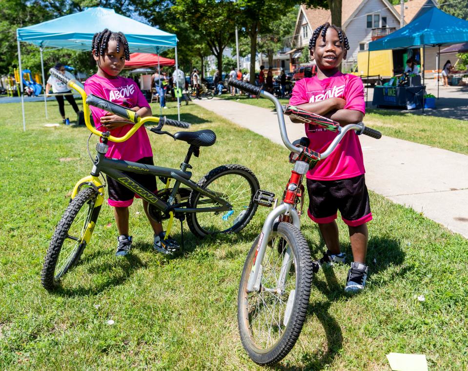 Elijah, left, and Victor Anderson, both 6, pose with their new bikes at the All About the Youth festival at Butterfly Park on West Meinecke Avenue in the Metcalfe Park neighborhood of Milwaukee in 2022.