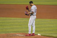 Philadelphia Phillies starting pitcher Vince Velasquez adjusts his cap during the third inning of a baseball game against the Miami Marlins, Monday, Sept. 14, 2020, in Miami. (AP Photo/Lynne Sladky)