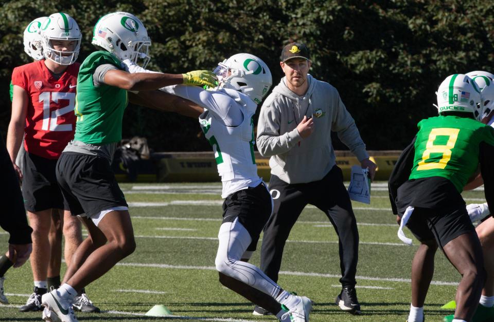 Oregon offensive coordinator Will Stein, right, supervises a drill during the second spring practice for the Oregon Duck football team on Saturday, March 16, 2024.