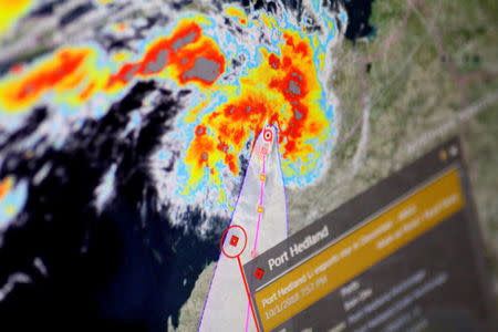 A cyclone is shown approaching Port Hedland, Australia, on an Eikon ship-tracking screen in this illustration photo January 11, 2018. REUTERS/Thomas White/Illustration