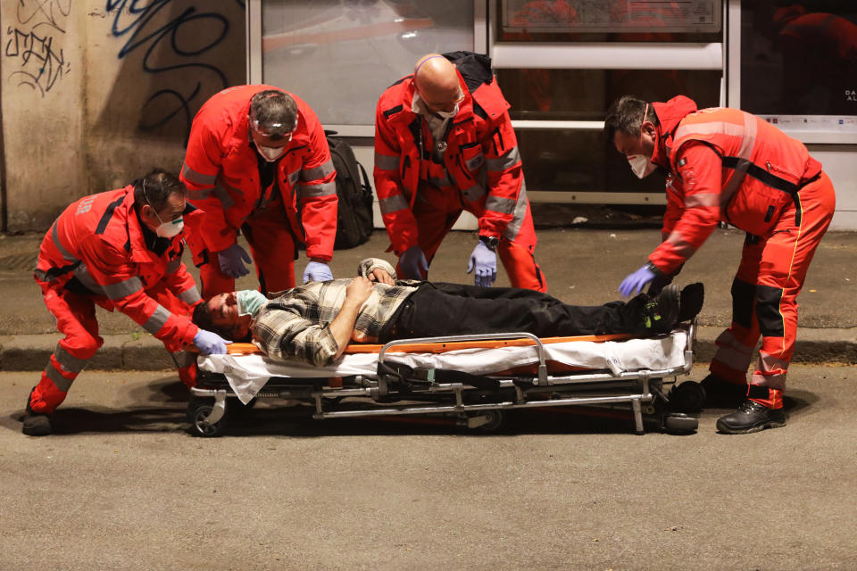 The man was then carried away by the medical personnel from an ambulance. Source: Getty Images