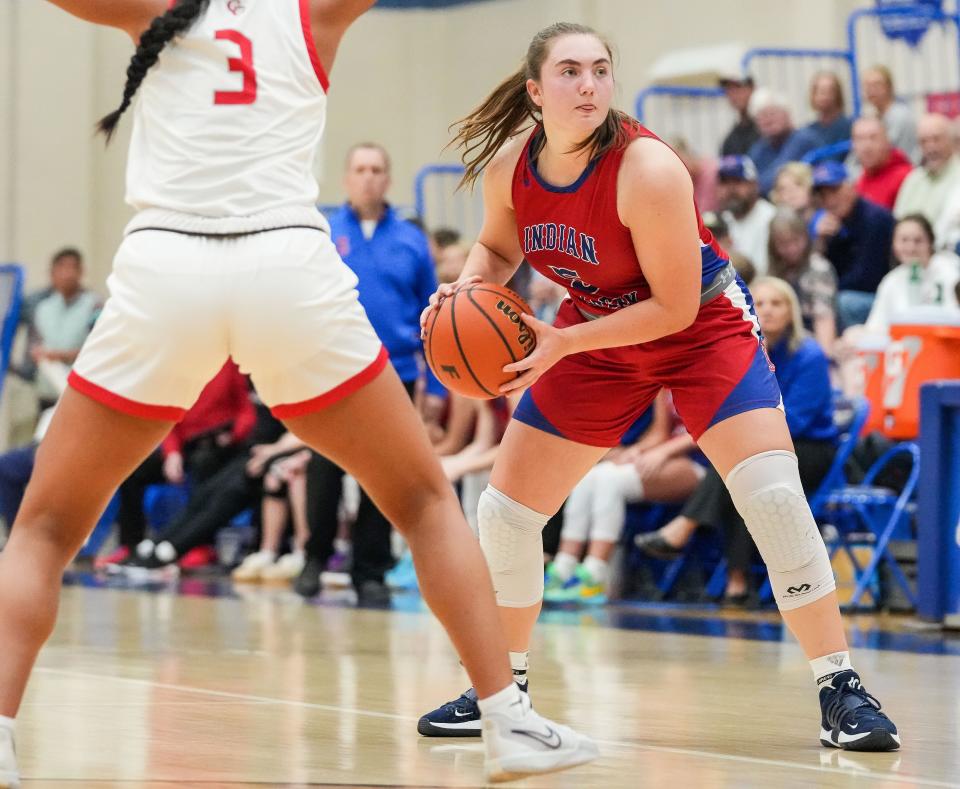 Indian Creek Lauren Foster (5) searches to pass the ball Thursday, Nov. 16, 2023, during the semifinals of the Johnson County Tournament at Franklin Community High School in Franklin. The Center Grove Trojans defeated Indian Creek, 61-52.
