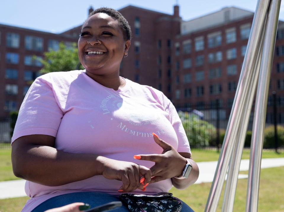 Anjelica Parker gives an interview outside Le Bonheur Children's Hospital on May 6, 2022, in Memphis. Parker works at the hospital after going through a local program that takes underemployed medical district residents and helps upskill them for jobs. 