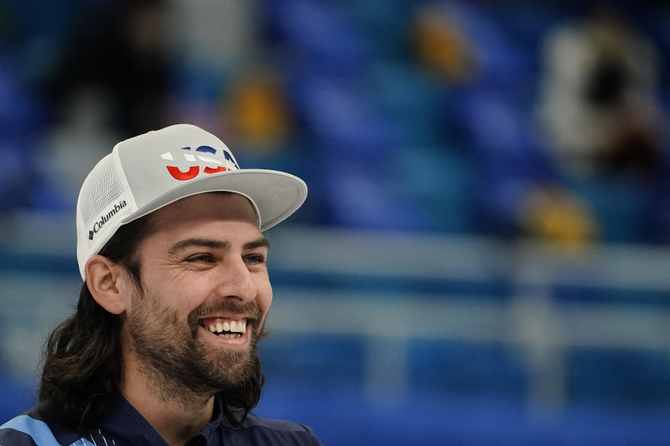 Christopher Plys, of the United States, smiles during a men's curling match against Sweden at the Beijing Winter Olympics Thursday, Feb. 10, 2022, in Beijing. (AP Photo/=03372652=)