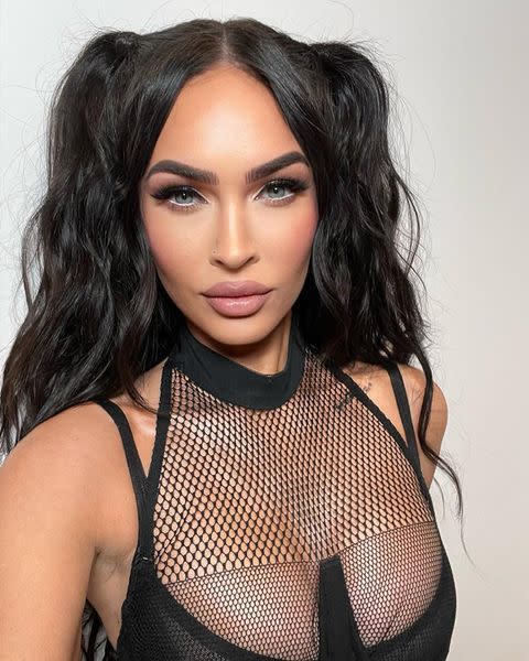 <p>Megan Fox's killer looks just keep on coming, and her latest was a tongue-in-cheek tribute to the Spice Girls. Taking to Instagram, the actor shared pictures of herself in a sultry black fishnet top with pigtails in a look she called 'BDSM Spice' – and we can't get enough of it. </p><p><a href="https://www.instagram.com/p/CaiJfGMPR2O/" rel="nofollow noopener" target="_blank" data-ylk="slk:See the original post on Instagram;elm:context_link;itc:0;sec:content-canvas" class="link ">See the original post on Instagram</a></p>