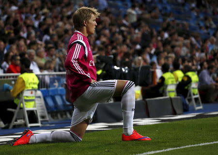 Real Madrid's Martin Odegaard warms up during their Spanish first division soccer match against Getafe at Santiago Bernabeu stadium in Madrid, Spain, May 23, 2015. REUTER/Juan Medina