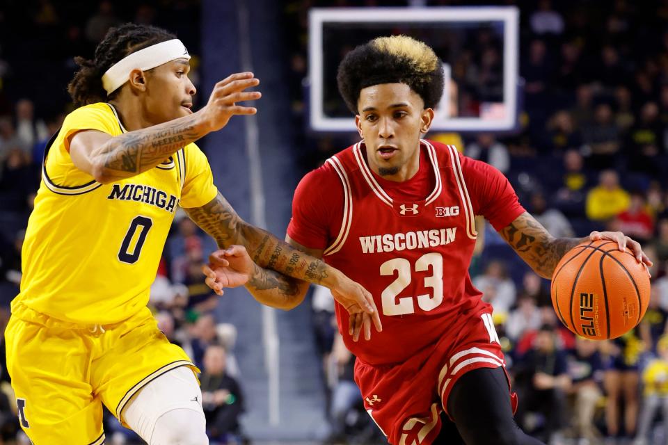 Wisconsin guard Chucky Hepburn dribbles defended by Michigan guard Dug McDaniel in the second half of U-M's 72-68 win on Wednesday, Feb. 7, 2024, at Crisler Center.