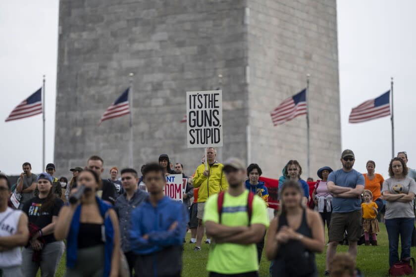 WASHINGTON, DC - JUNE 11: Anti-gun violence demonstrators gather on the National Mall near the Washington Monument for a March for Our Lives Rally on Saturday, June 11, 2022 in Washington, DC. (Kent Nishimura / Los Angeles Times)