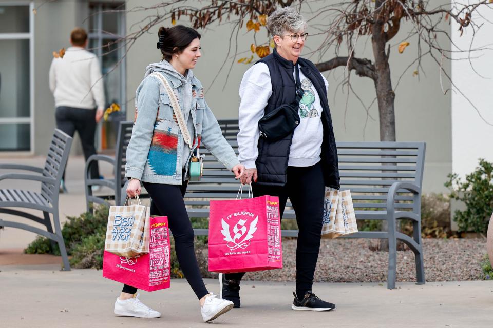 Karen Archer and Harlee Benkley shop during December at the OKC Outlet Mall in Oklahoma City.