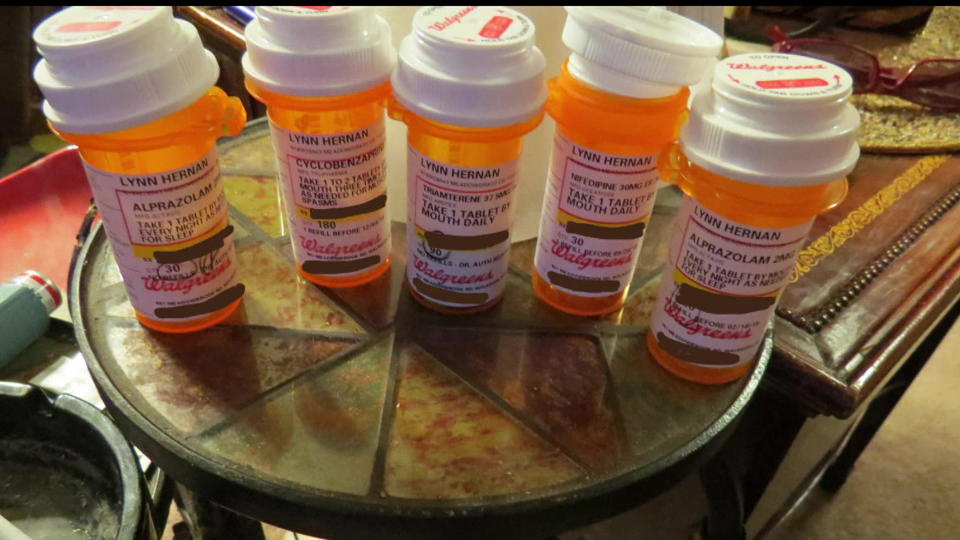 A photo of Lynn Hernan's prescription bottles that were on a table next to her recliner.  First responders at the scene said it looked like Hernan had possibly died from an accidental overdose, or by taking her own life.  / Credit: Waukesha County Circuit Courts