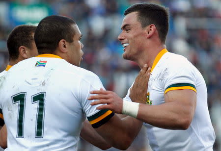 South Africa's Bryan Habana (L) celebrates with teammate Jesse Kriel after he scored a try during their rugby union test match against Argentina in Buenos Aires August 15, 2015. REUTERS/Marcos Brindicci