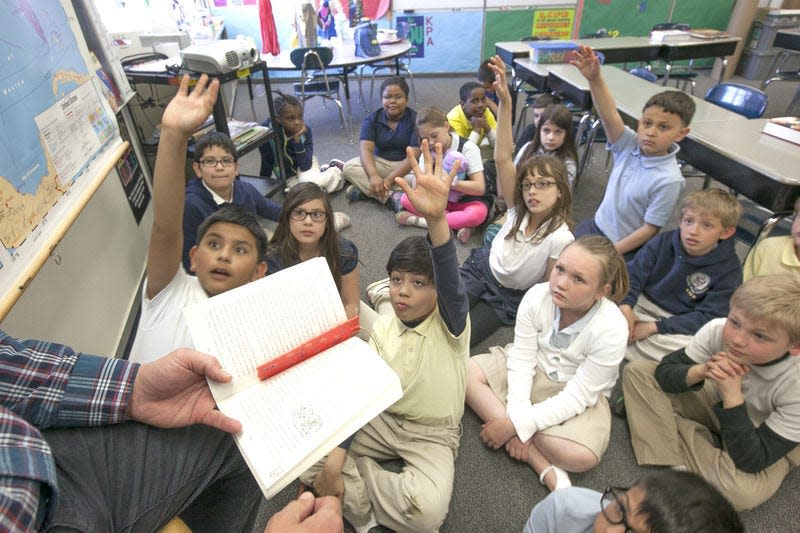 In this 2015 file photo, students in Joe Brookshire’s third-grade class ask questions during class at Kennedy Primary Academy in South Bend. The state on Friday released results of the IREAD tests taken by third-graders. SBT Photo/SANTIAGO FLORES